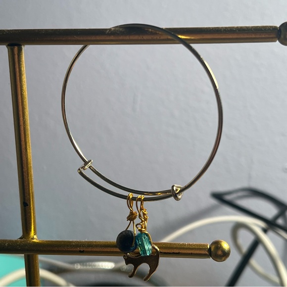 gold metal bracelet with cat, bead, & blue gemstone charms - Picture 5 of 5